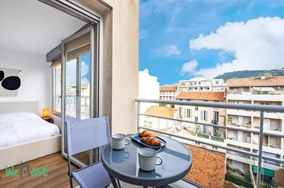 a living room with a couch and a table at WH Gasiglia - Casa So Nice in Nice
