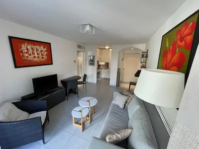 a living room with a couch and a table at Nice Massena 2 rooms in Nice