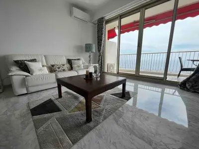 a living room with a couch and a coffee table at Beautiful Apartment Pool & Garage See View in Nice