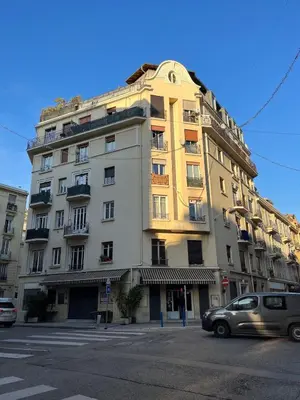 a yellow building on the corner of a street at Nice Gare Studio in Nice