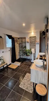 a large bathroom with a sink and a counter at Chambres d'hôtes D'AQUI D'AIA in Saint-Laurent-du-Var