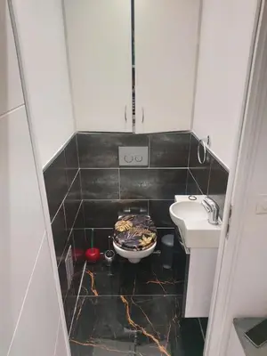 a small bathroom with a toilet and a sink at Cozy appartment downtown Nizza 2 Bedroom 1 min Beach 1 min tramway 10min airport air conditionner in Nice