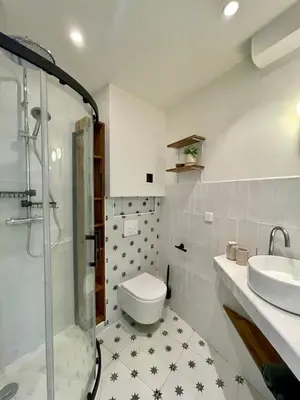a bathroom with a shower and a toilet and a sink at Cosy 1 Bedroom Place Massena in Nice