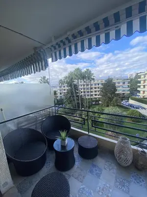 a balcony with chairs and a view of the water at Nice Ouest Caucade- Beautiful 2P, AC, Clim in Nice