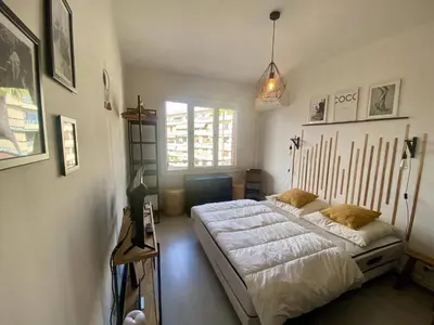 a bedroom with a large bed and a window at Nice Ouest Caucade- Beautiful 2P, AC, Clim in Nice