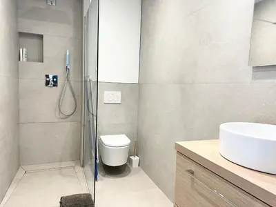 a bathroom with a shower and a toilet and a sink at Beautiful & cosy appart, calme et lumineux in Nice