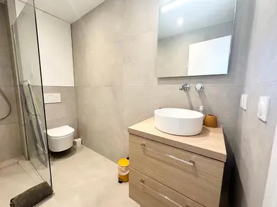 a bathroom with a sink and a glass shower at Beautiful & cosy appart, calme et lumineux in Nice