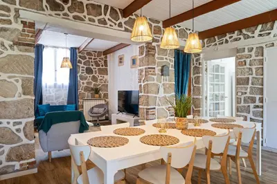 a dining room with a white table and chairs at Maison de ville familiale, 5 chambres, terrasse, à 20 minutes du centre ville in Nice