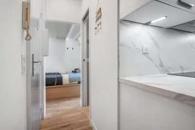 a bedroom with white walls and a closet with a bed at Nice Renting - HONORE - Elegant apartment near Promenade des Anglais in Nice