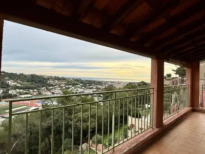 a balcony with a view of a city at Magnifique Studio Cagnes Sur Mer in Cagnes-sur-Mer