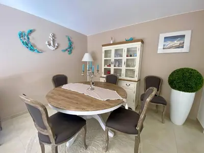 a dining room with a table and chairs at Nice Ouest 2P Sea view, Pool, Quiet in Nice