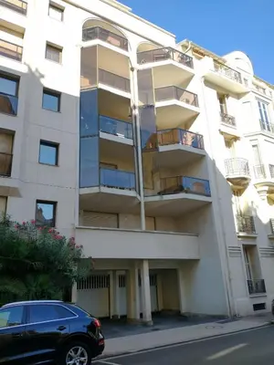 an apartment building with a car parked in front of it at Rivoli- Quiet apartment, close to Negresco in Nice