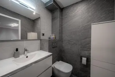 a bathroom with a sink and a toilet at Cozy Appartement close to Port of Nice in Nice