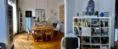 a living room with a table and a dining room at Beau 3 pièces Libération Nice in Nice