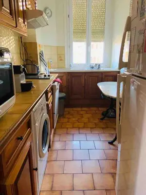 a kitchen with a washer and dryer in it at Pleasant central apartment with balcony in Nice