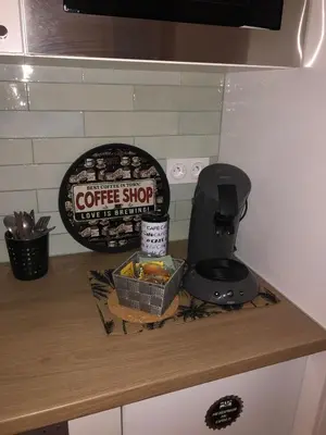 a counter top with a coffee shop sign on it at Lovely cozy studio in Nice