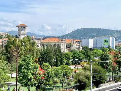 a city with a clock tower in a park at ApartHotel riviera - Balcon Jean Jaures 2 - Place Massena - Old in Nice