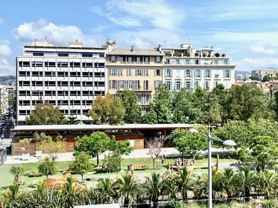 a large building with a park in front of it at ApartHotel riviera - Balcon Jean Jaures 2 - Place Massena - Old in Nice