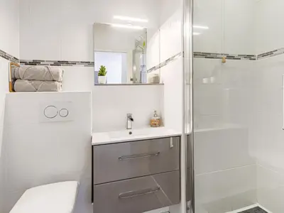 a bathroom with a shower and a sink and a toilet at Apartment Le Palais du Vieux Port by Interhome in Nice