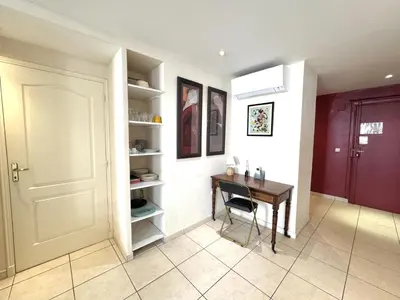 a room with a desk and a table and a door at ApartHotel Riviera - Hotel des Postes 2 - City center Massena in Nice