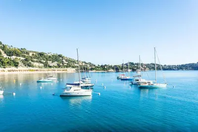 a view of a harbor from an open window at MARINE AP4445 By Riviera Holiday Homes in Villefranche-sur-Mer