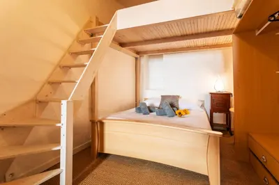 a bedroom with a bunk bed and a staircase at ESCALINADA II AP4433 by Riviera Holiday Homes in Villefranche-sur-Mer