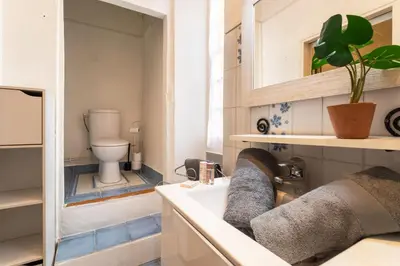 a bathroom with a sink and a toilet at ESCALINADA II AP4433 by Riviera Holiday Homes in Villefranche-sur-Mer