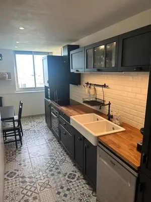 a kitchen with a sink and a counter top at Cocon Azur avec vue panoramique sur mer - 4 chambres in Nice