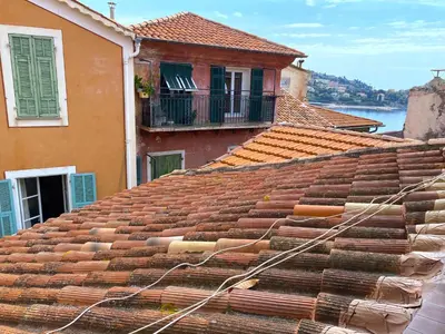 a view of a tile roof of a building at PERCHOIR AP4443 By Riviera Holiday Homes in Villefranche-sur-Mer