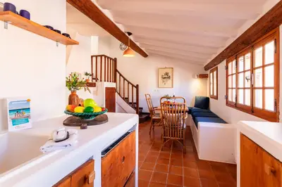 a kitchen and living room in a tiny house at PERCHOIR AP4443 By Riviera Holiday Homes in Villefranche-sur-Mer