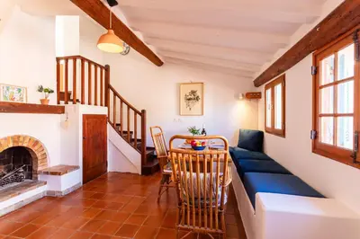a living room with a couch and a table at PERCHOIR AP4443 By Riviera Holiday Homes in Villefranche-sur-Mer