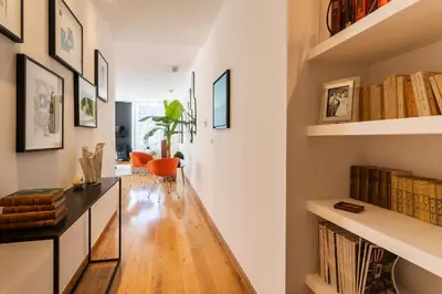 a hallway with a desk and bookshelves at PORT LYMPIA AP4429 By Riviera Holiday Homes in Nice