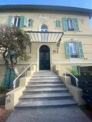 a house with stairs leading up to a door at Centre-ville Proche gare in Nice