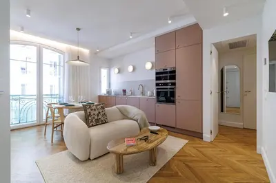 a living room with a couch and a table at Maison Galbani Architect-designed apartment in Nice