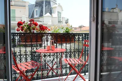 a living room with a couch and a table at Top floor appartement - central in Nice