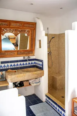 a bathroom with a sink and a shower at Village house surrounded by greenery in La Gaude