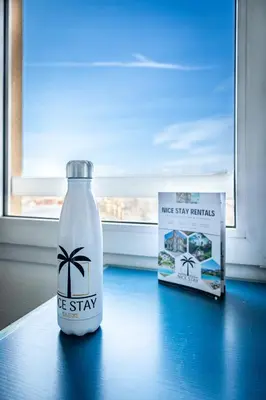 a bottle of water and a box on a table at Studio hypercentre gare in Nice