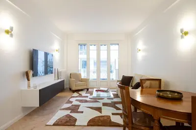 a living room with a table and a dining room at Beautiful 3 rooms, Carré d 'Or in Nice