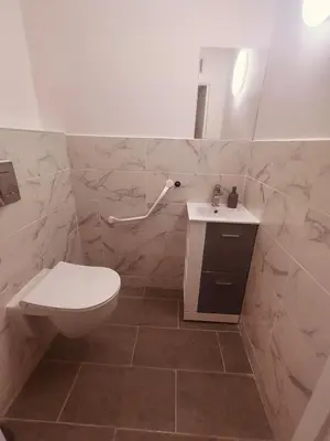 a bathroom with a toilet and a sink at Superbe appartement T2 de 95 m in Nice