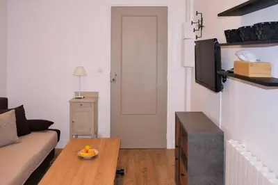 a living room with a couch and a table at Barla 1 - a cosy one bedroom apartment in Nice in Nice
