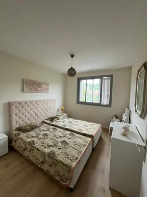 a bedroom with a large bed and a window at Jolie appartement à Nice in Nice