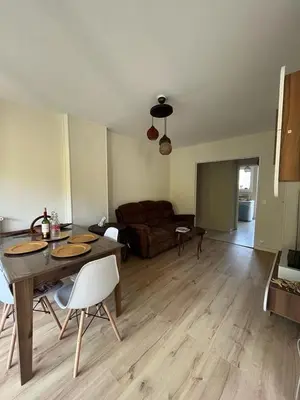 a living room with a table and a couch at Jolie appartement à Nice in Nice