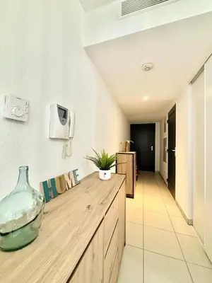a room with a counter with a vase on it at Nid douillet rénové et tramway à 1 min in Nice