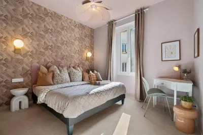 a bedroom with a large bed and a wall at Nice Renting - 8BONAPARTE - Architect Loft Luxury 4 Bedrooms View Place du Pin in Nice