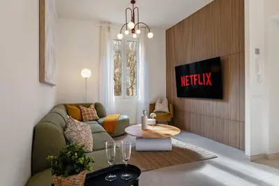 a living room with a couch and a table at Nice Renting - 8BONAPARTE - Architect Loft Luxury 4 Bedrooms View Place du Pin in Nice
