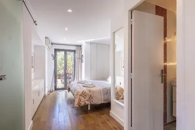 a bedroom with a bed and a large mirror at Villa Margot ' Exceptional Place in Villefranche-sur-Mer