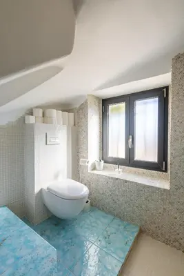 a bathroom with a white toilet and a window at Villa Margot ' Exceptional Place in Villefranche-sur-Mer