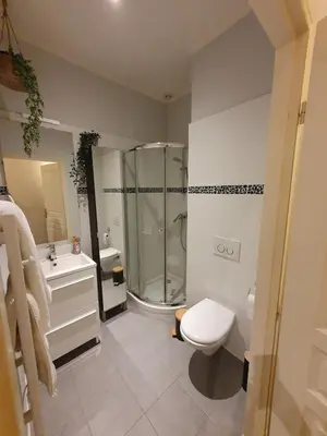 a bathroom with a shower and a toilet and a sink at Studio au cœur du vieux Nice in Nice