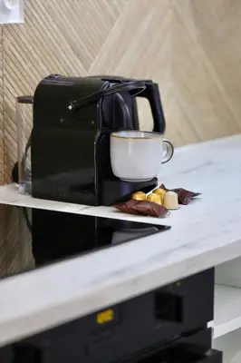 a coffee maker sitting on top of a counter at Superbe appartement & proche mer in Nice