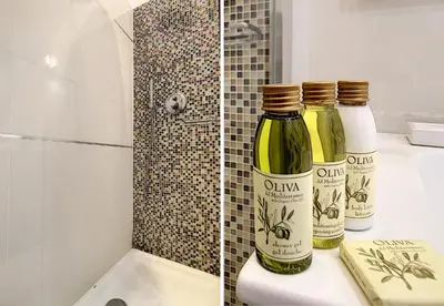two bottles of wine sitting on a bathroom counter at Nestor&Jeeves - COTE JARDIN - Central - Close sea in Nice
